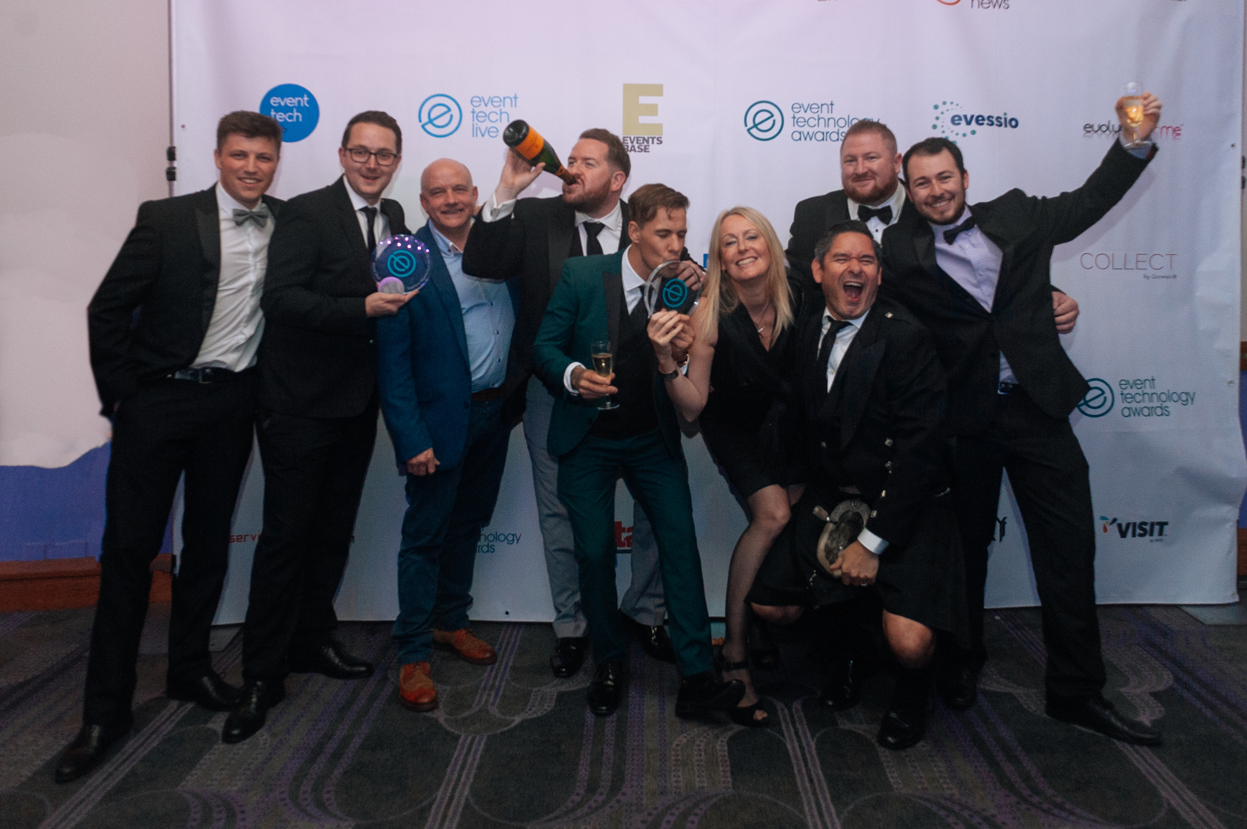 group celebrating event technology award win 