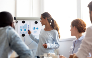 woman evaluating event statistics with clients