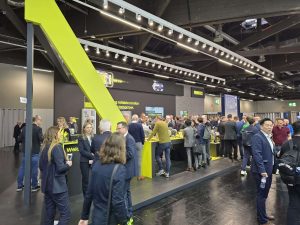Lots of people at a business expo booth