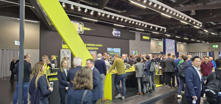 Lots of people at a business expo booth